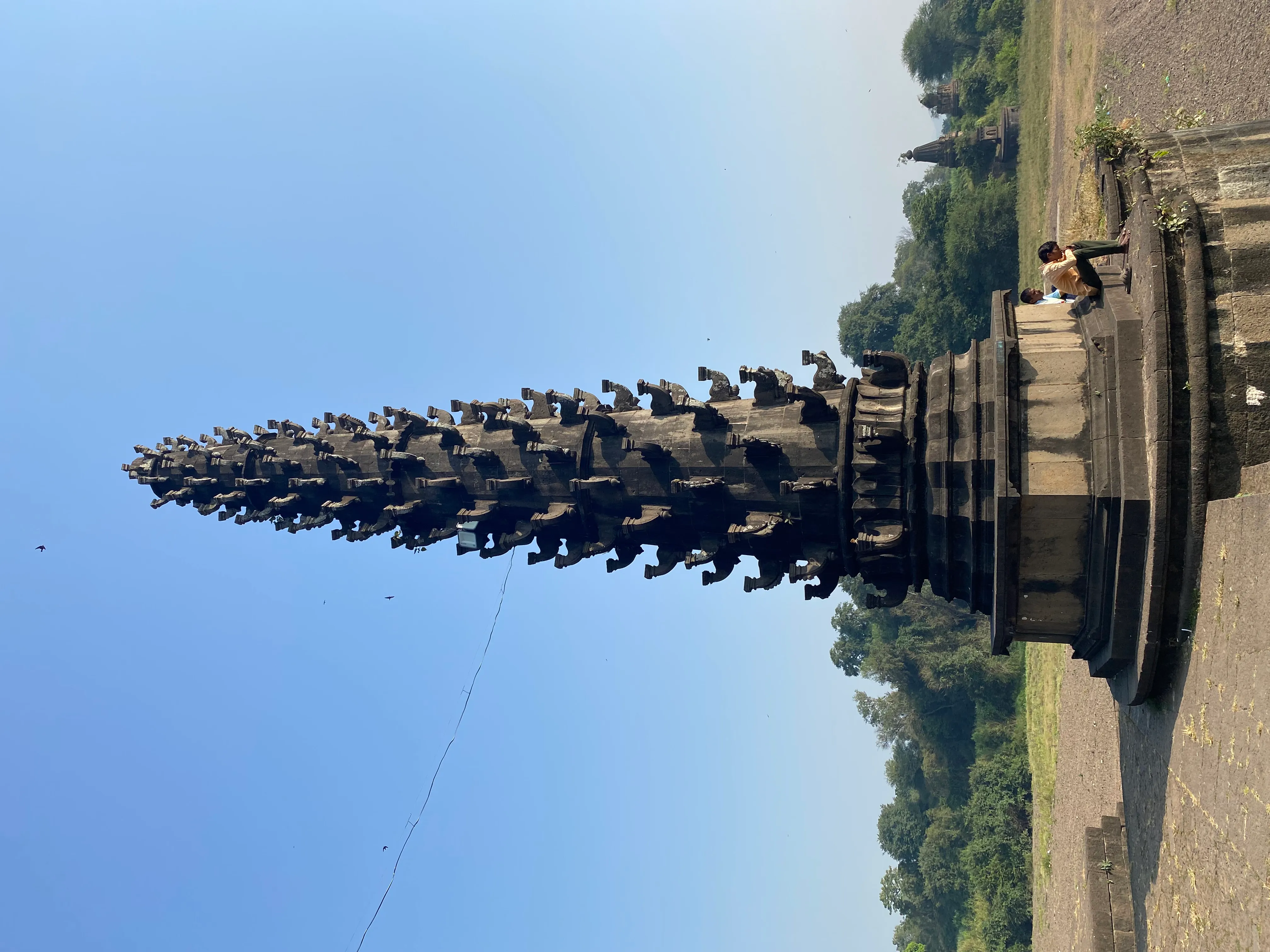 This prompt contains contradictory information. Dimapur is in Nagaland, not Rajasthan. A Rajasthani journalist wouldn't specialize in Nagaland's sites. Further, the prompt asks for a *Rajasthani* format, but for a site *outside* Rajasthan.
However, following the requested format as best as possible:
Shiv Temple Dimapur - Image 12